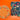 Three colorful, ornately decorated holiday tins and boxes with festive patterns, accompanied by assorted wrapped chocolates, set against a vibrant orange background.