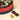 A round Vintage Dream Hamper with Assorted Chocolates Large, accompanied by three unwrapped, artisan chocolates. - AI generated text
