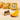 A Chocoviar Mango chocolate, adorned with delicate white cocoa granules and gold foil, beside a slice of fresh mango. - AI generated text