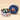Vintage Dream Medium Tin: a refined blue holiday hamper featuring star motifs and a bow, filled with assorted chocolates. - AI generated text