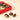 Vintage Dream gift box featuring holiday ornaments and three unwrapped, premium hazelnut chocolates. - AI generated text