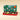 An open Vintage Dream Assorted Chocolates ornament gift box presented beside a holiday box tied with a green ribbon. - AI generated text