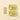 A Pistachio Chocobiscuit Snack Bar from a set of six rests beside eight wrapped Chocoviar bars on an elegant beige background. - AI generated text