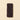 Six elegantly arranged ChocoNougatine bars. A bundle of 6 rectangular ChocoNougatine bars with bumpy dark chocolate on a beige background. - AI generated text