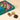 Open Vintage Dream Deluxe gift box filled with assorted chocolates, with three unwrapped chocolates in the foreground. - AI generated text