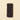 ChocoNougatine snack 35g: a refined rectangular dark chocolate bar with crisp rice, set against a simple beige backdrop. - AI generated text